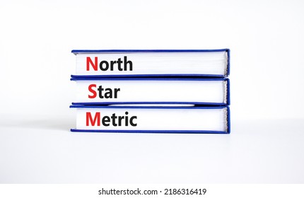 NSM North Star Metric Symbol. Concept Words NSM North Star Metric On Books On A Beautiful White Background. Business And NSM North Star Metric Concept. Copy Space.