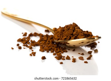 nstant coffee in the spoon on white background