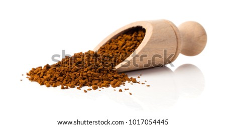 nstant coffee in the spoon on white background