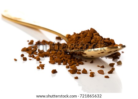 nstant coffee in the spoon on white background