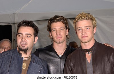 *NSYNC stars JUSTIN TIMBERLAKE, JC CHASEZ & CHRIS KIRKPATRICK at the American Music Awards in Los Angeles. 09JAN2002.   Paul Smith/Featureflash