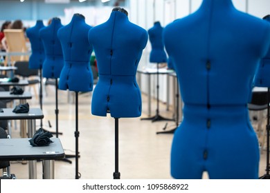 nterior of garment factory shop. Closes making atelier with several sewing machines. Tailoring industry. - Powered by Shutterstock