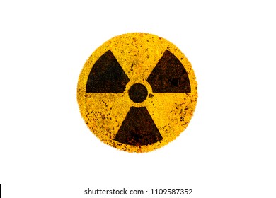 Nuclear energy radioactive (ionizing radiation) nuclear round yellow and black danger warning symbol on rusty metal grungy texture and isolated on white background.