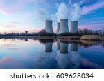 Nuclear power plant after sunset. Dusk landscape with big chimneys.