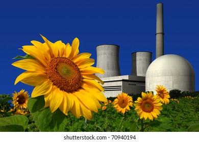 Nuclear power plant behind a sunflower field