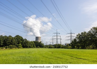 Nuclear power plant with cooling tower and power lines