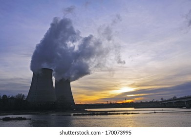 Nuclear Power Station In France On Background Sunset