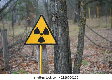 Nuclear radioactive danger sign in forest in Chernobyl exclusion zone around Chornobyl Nuclear Power Station