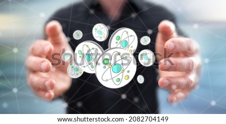 Nuclear research concept between hands of a man in background