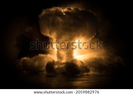 Nuclear war concept. Explosion of nuclear bomb. Creative artwork decoration in dark. Selective focus