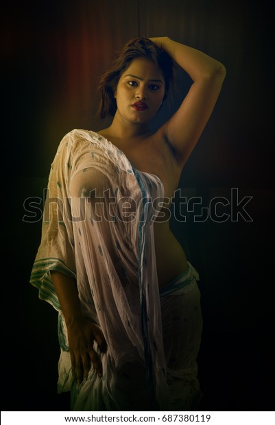 nude-lady-wet-transparent-saree-600w-687380119.jpg