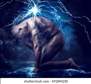 Nude Profile Of Young Black Muscle Man Crouching In Fog In Studio With Black Background, With Smoke And Lightnings Effect