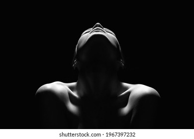 Nude Woman silhouette in the dark. Beautiful Sexy Naked Body Girl
