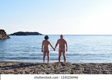 A Nudist Couple On The Beach