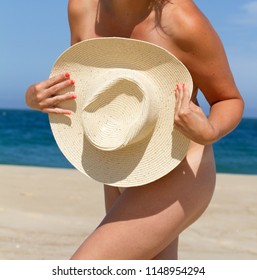 Nudist Woman On A Beach