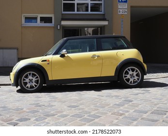 NUERNBERG, GERMANY - CIRCA JUNE 2022: Yellow Mini Car