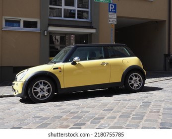 NUERNBERG, GERMANY - CIRCA JUNE 2022: Yellow Mini Car