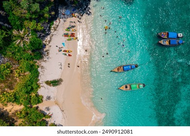 Nui beach and long tail boat in Phi Phi Don island, Krabi, aerial top view. Concept beauty nature of Thailand, travel Phuket. - Powered by Shutterstock