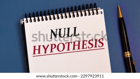 NULL HUPOTHESIS - words in a white notebook on a blue background with a pen. Info concept