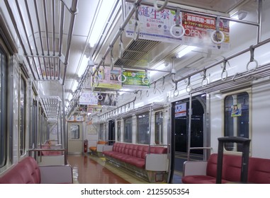 Numazu, Japan - May 2014: View Of Interior Of Empty Japanese Train Wagon Stop At Platform Of Numazu Station At Night. No People.