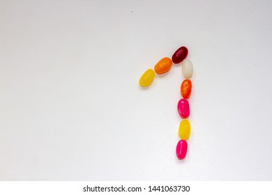 Number 1 With The One Formed Out Of Colorful Sweet Jelly Beans On A White Background