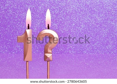 Number 1 and question mark on a pink background with blurred bright dots - Birthday or anniversary card with abstract blurred dots that glow