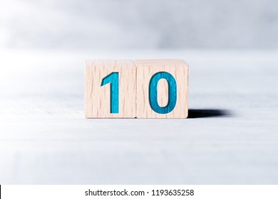 Number 10 Formed By Wooden Blocks On A White Table - Shutterstock ID 1193635258