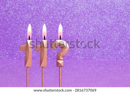 Number 11 and question mark on a pink background with blurred bright dots