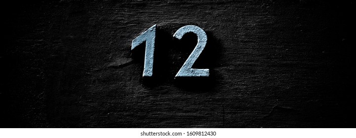 Number 12, twelve, on dark background, panoramic stripe. - Shutterstock ID 1609812430