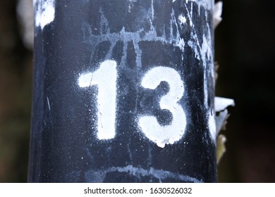 Number 13 Sprayed With White Paint - Bad Luck Superstition Concept