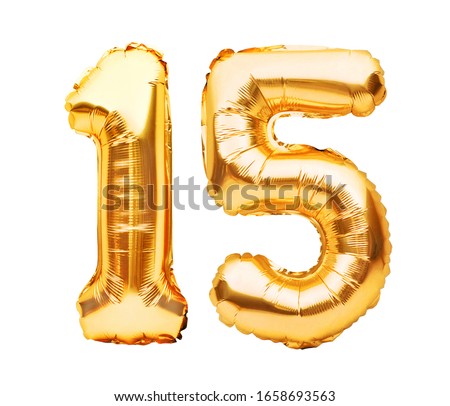 Number 15 fifteen made of golden inflatable balloons isolated on white. Helium balloons, gold foil numbers. Party decoration, anniversary sign for holidays, celebration, birthday, carnival
