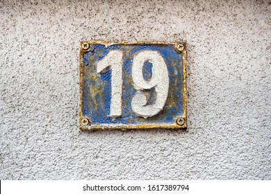 Number 19, Nineteen, Street Number Sign On The Wall