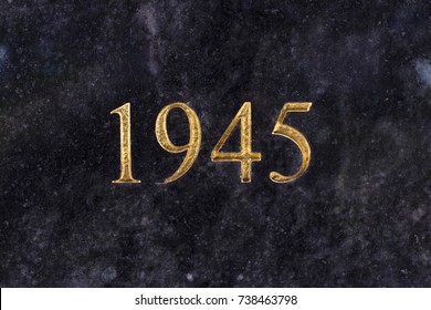 The number 1945, engraved in gold letters on marble.