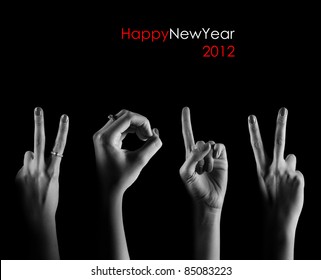 The number 2012 are shown via fingers in creative New Year greeting card