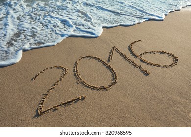 Number 2016 handwritten on seashore sand. Concept of upcoming new year and passing of time. - Powered by Shutterstock