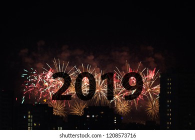 The number 2019 against the backdrop of fireworks - Shutterstock ID 1208573716