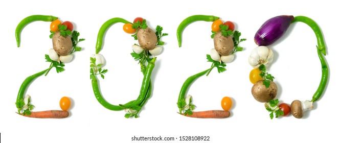 Number 2020 Written With Vegetables, As A Metaphor Or Concept For Healthy Food, Living, Diet, Recipe. Isolated On White Background. Happy New Year. End Of The Year Resolution