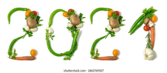 Number 2021 And Healthy Written With Vegetables, Concept For Healthy Food, Living, Covid 19, Coronavirus Prevention. Isolated On White Background. Happy New Year. End Of The Year Resolution