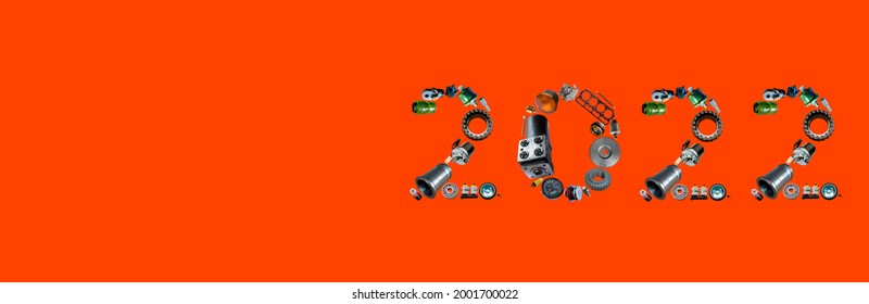 Number 2022 written with truck, tractors and car spare parts. New year concept for repair shop, workshop, diy isolated on red background. Banner.