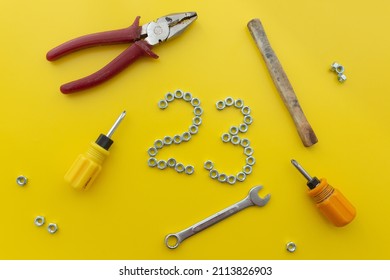 The number 23 of nuts on a yellow background. Defender of the Fatherland Day. conception International Men's Day and Fatherland defender day February 23. greeting card. top view - Powered by Shutterstock