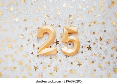 Number 25 twenty five golden celebration birthday candle on Festive Background. twenty five years birthday. concept of celebrating birthday, anniversary, important date, holiday