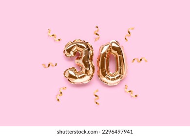 Number 30 gold air balloons with ribbon confetti on a pink background. - Powered by Shutterstock