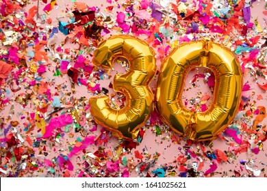 Number 30 Gold Birthday Celebration Balloon On A Confetti Glitter Background