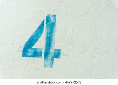 The Number 4 On The Dirty White Wall