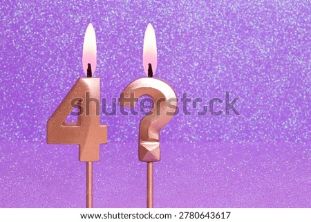 Number 4 and question mark on a pink background with blurred bright dots - Birthday or anniversary card with abstract blurred dots that glow