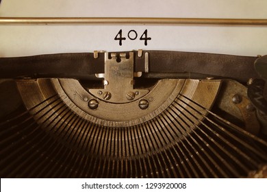 The number 404 is printed on a sheet of paper with an old typewriter.