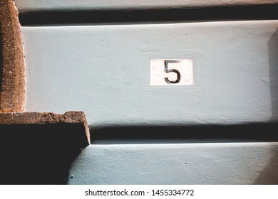 Number 5 Door Sign Painted At Facade