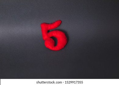 Number 5. Hand Made Number 5 From Red Felt. Number From Colorful Felt On Grey Background. Elementary School. Handmade Numbers. 