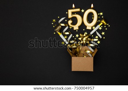 Number 50 gold celebration candle and gift box background