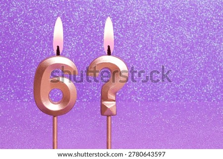 Number 6 and question mark on a pink background with blurred bright dots - Birthday or anniversary card with abstract blurred dots that glow